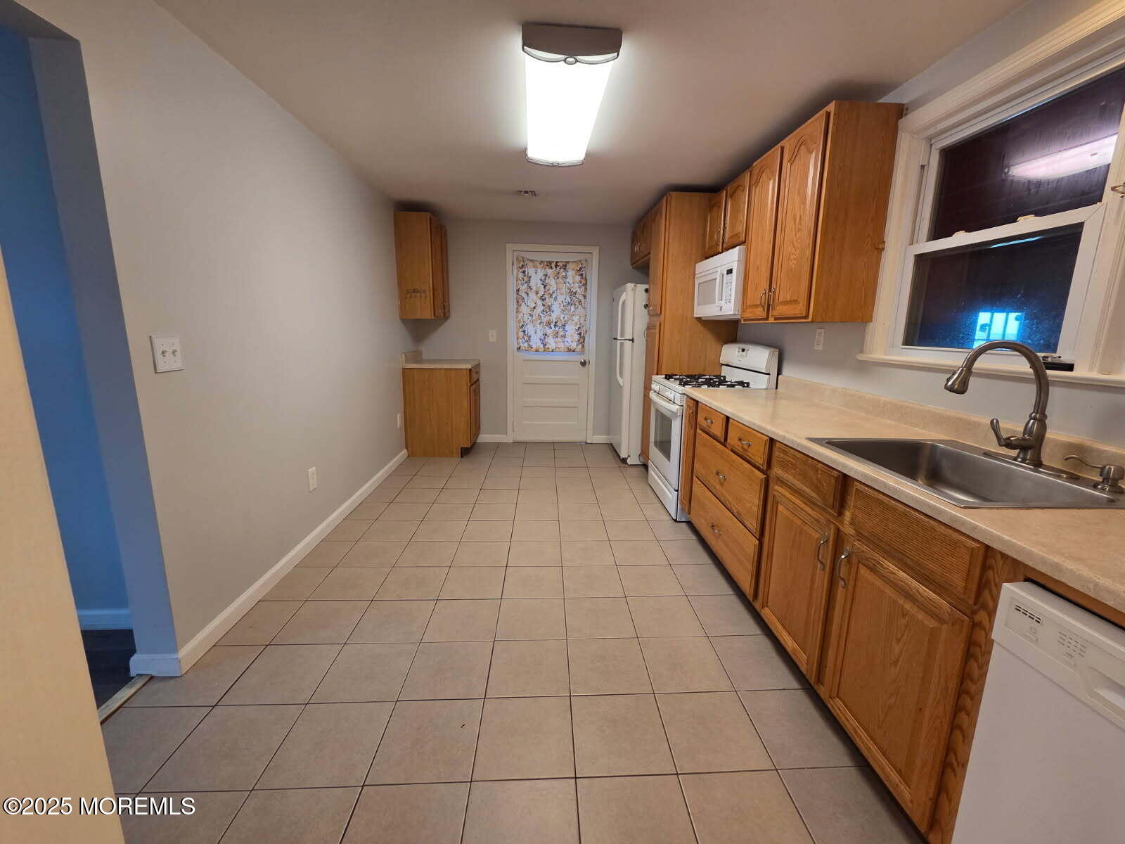 219 Dock Street Union Beach, NJ 07735 - Photo 8 of 22 a kitchen with stainless steel appliances a sink stove and cabinets