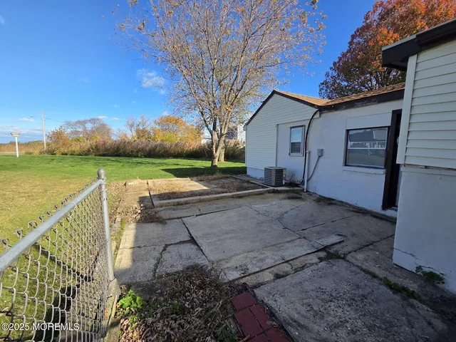 a view of a backyard and hardwood