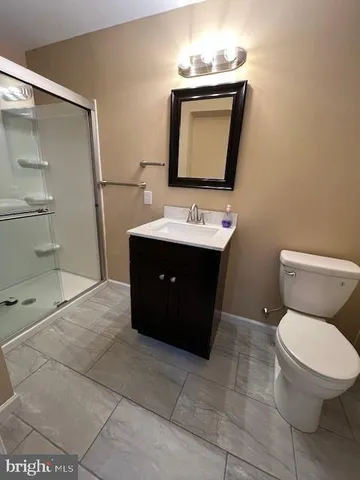 a view of empty room with window and chandelier fan