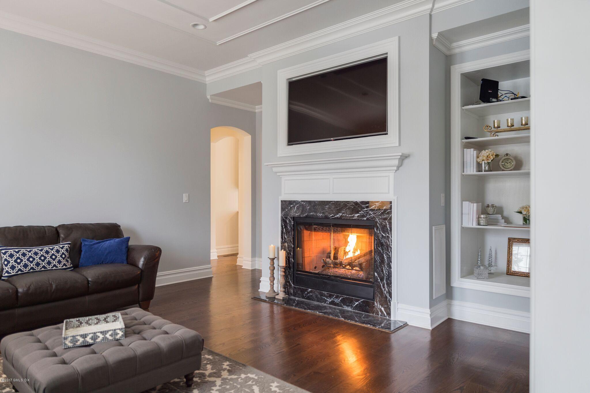 69 Circle Drive Greenwich, CT 06830 - Photo 7 of 21 a living room with furniture and a flat screen tv