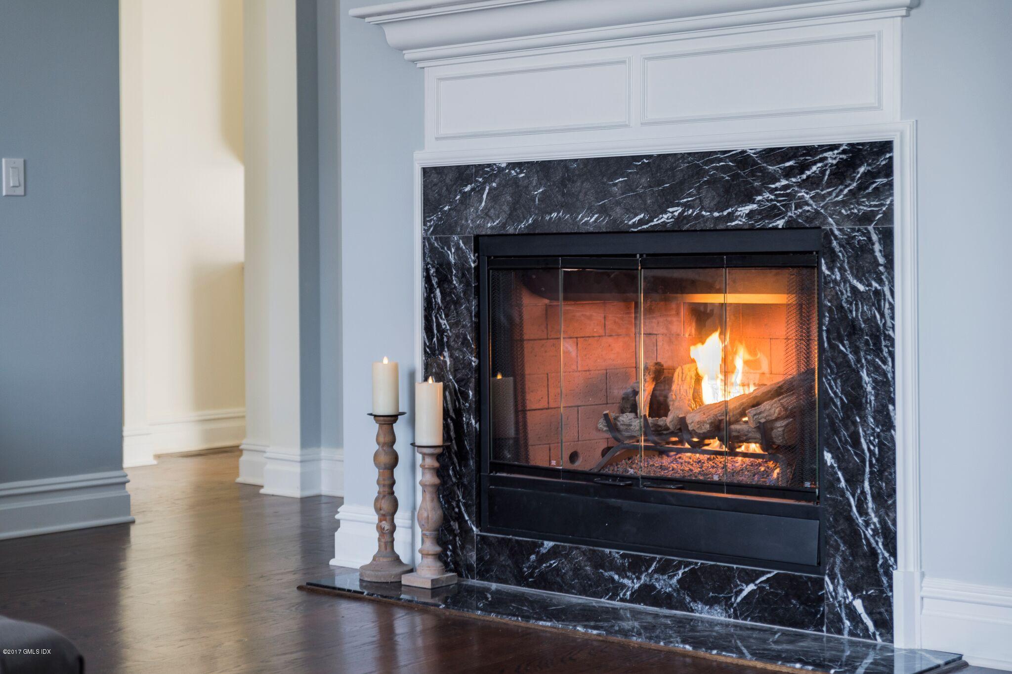 69 Circle Drive Greenwich, CT 06830 - Photo 8 of 21 a view of fireplace and wooden floor