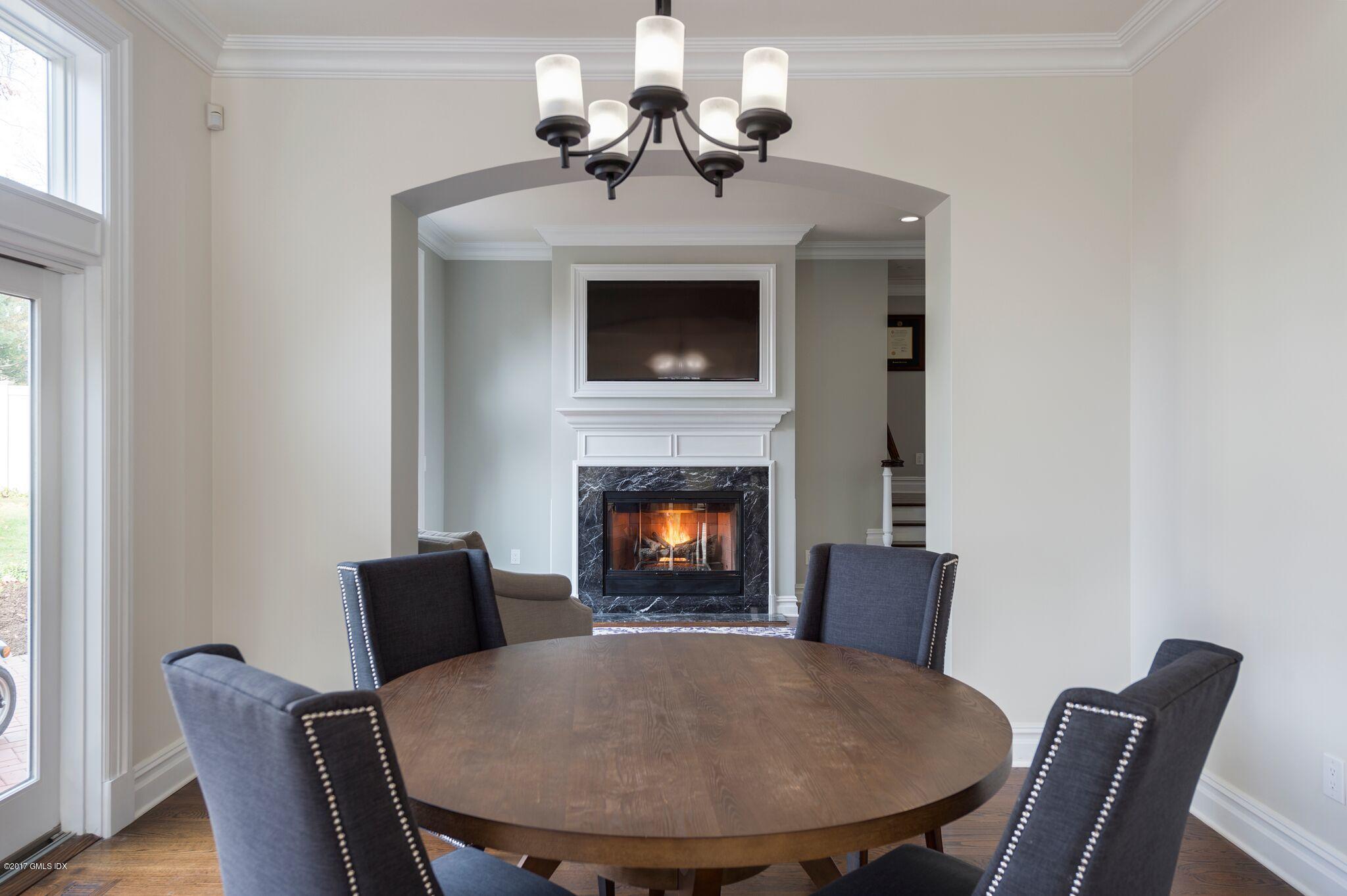 69 Circle Drive Greenwich, CT 06830 - Photo 9 of 21 a view of a dining room with furniture and wooden floor