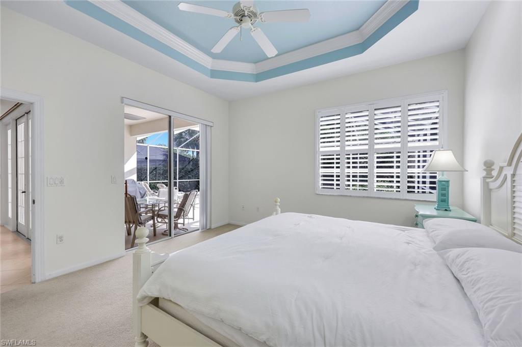 9375 Oak Strand Drive Estero, FL 34135 - Photo 14 of 30 a bedroom with a bed and a window