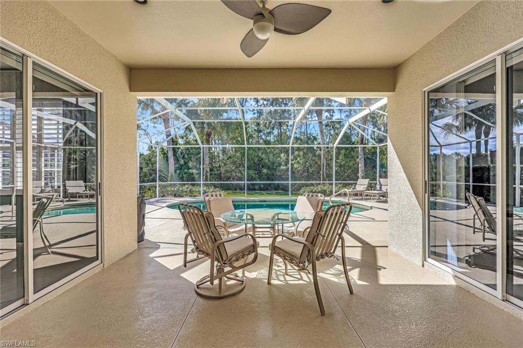 9375 Oak Strand Drive Estero, FL 34135 - Photo 20 of 30 a view of a chairs and table in a room