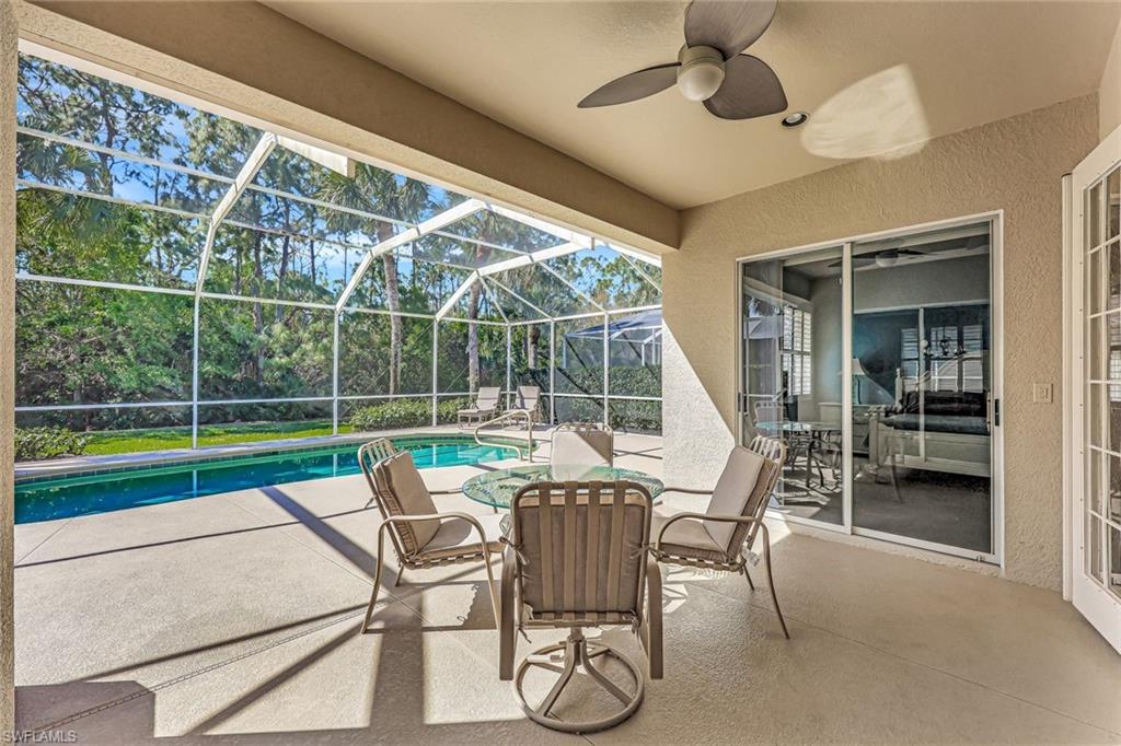 9375 Oak Strand Drive Estero, FL 34135 - Photo 21 of 30 a view of a chair and tables in the patio
