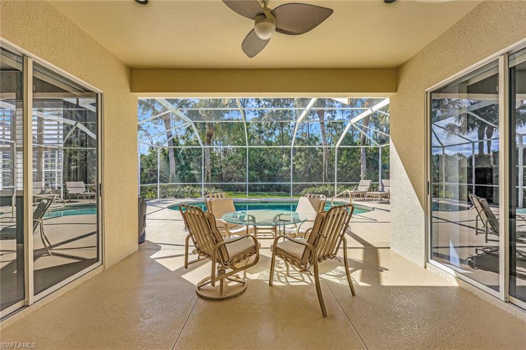 9375 Oak Strand Drive Estero, FL 34135 - Photo 22 of 32 Sunroom / solarium featuring a pool and a ceiling fan