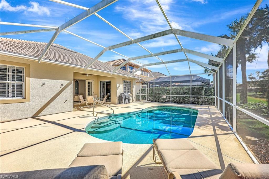 9375 Oak Strand Drive Estero, FL 34135 - Photo 23 of 30 a view of a swimming pool with a patio