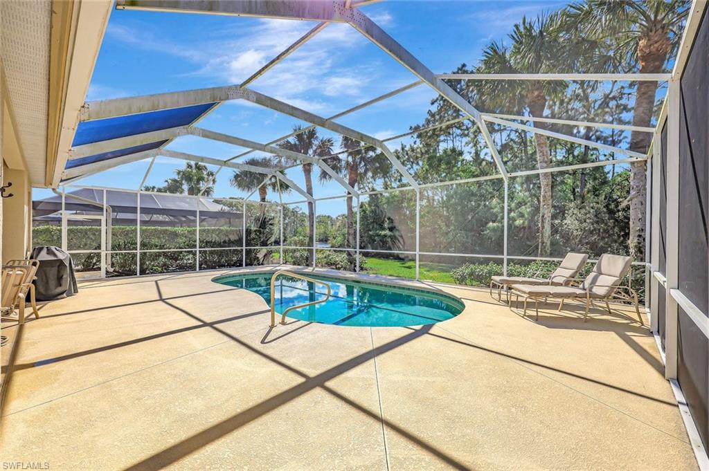9375 Oak Strand Drive Estero, FL 34135 - Photo 24 of 32 Pool featuring a lanai and a patio