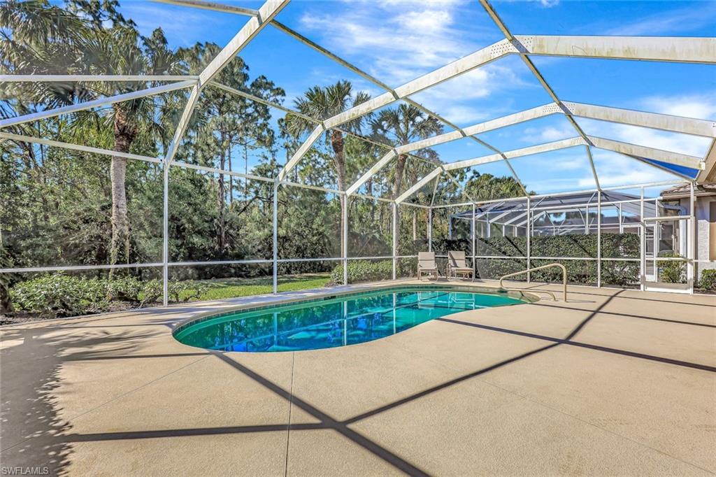 9375 Oak Strand Drive Estero, FL 34135 - Photo 25 of 30 a view of a backyard with a small house