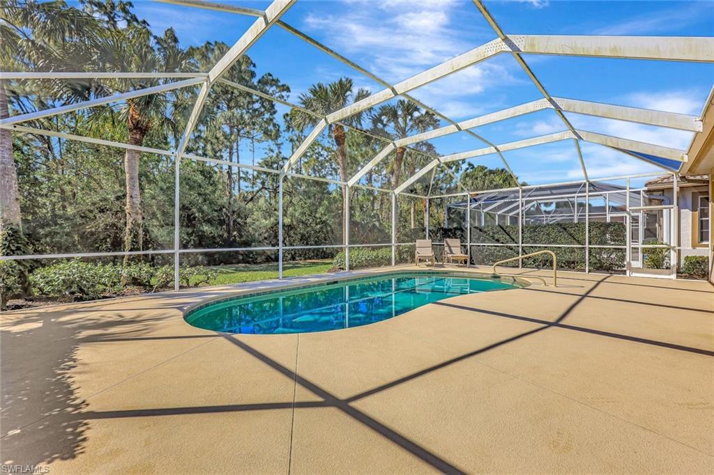 9375 Oak Strand Drive Estero, FL 34135 - Photo 27 of 32 Pool with a patio and glass enclosure