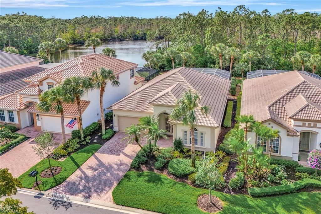 9375 Oak Strand Drive Estero, FL 34135 - Photo 3 of 32 Bird's eye view with a water view and a wooded view