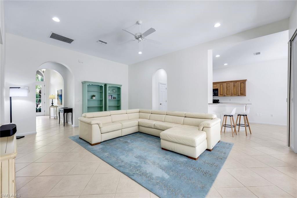 9375 Oak Strand Drive Estero, FL 34135 - Photo 7 of 30 a living room with furniture and a flat screen tv