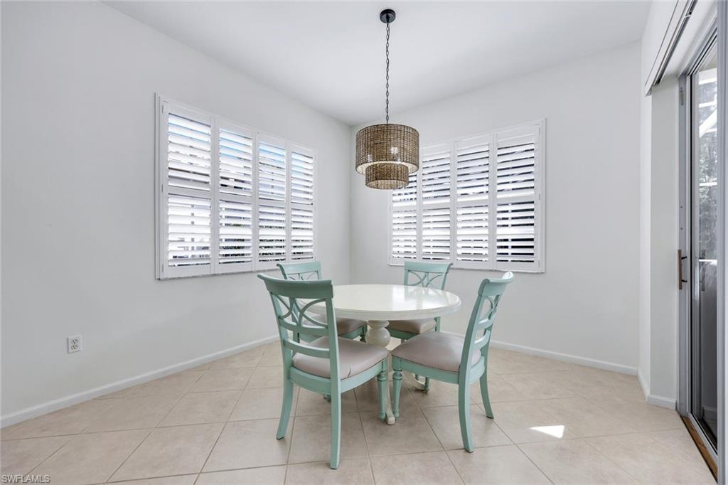 9375 Oak Strand Drive Estero, FL 34135 - Photo 8 of 30 a dining room with furniture and window