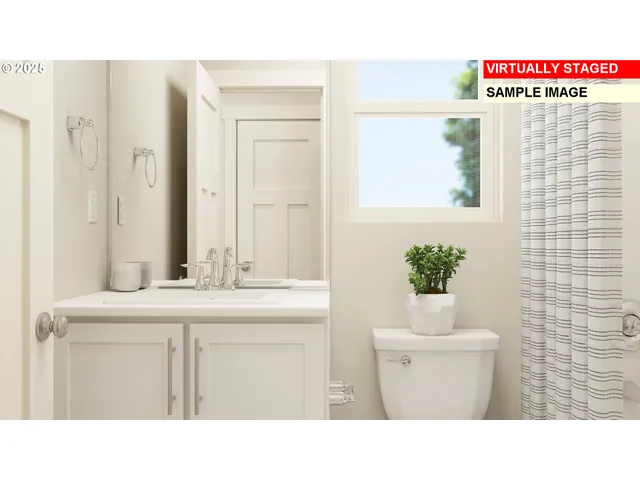 a bedroom with a bed and a night stand