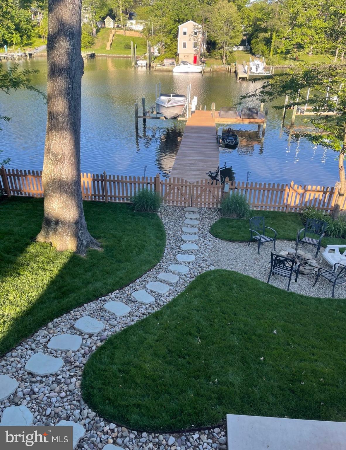 787 Powhatan Beach Road Pasadena, MD 21122 - Photo 2 of 12 a view of a house with a yard and potted plants
