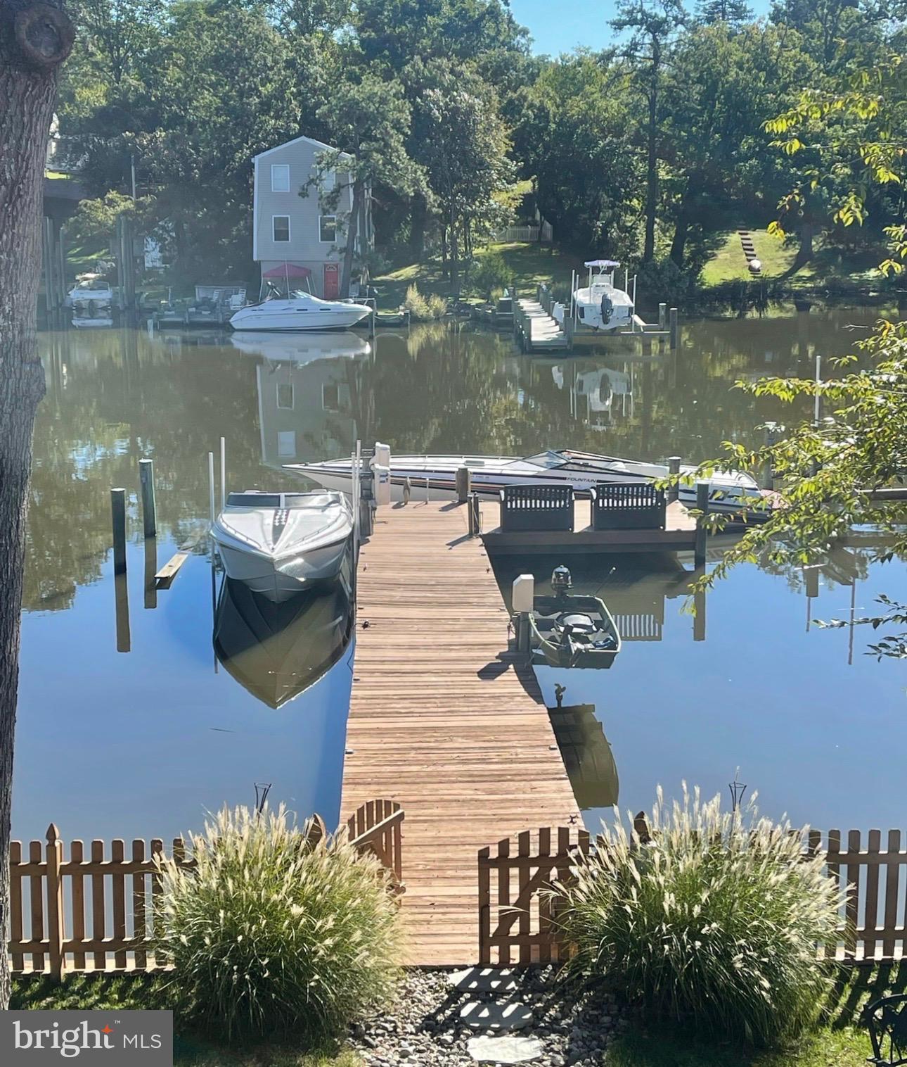787 Powhatan Beach Road Pasadena, MD 21122 - Photo 4 of 12 a view of a lake with sitting area