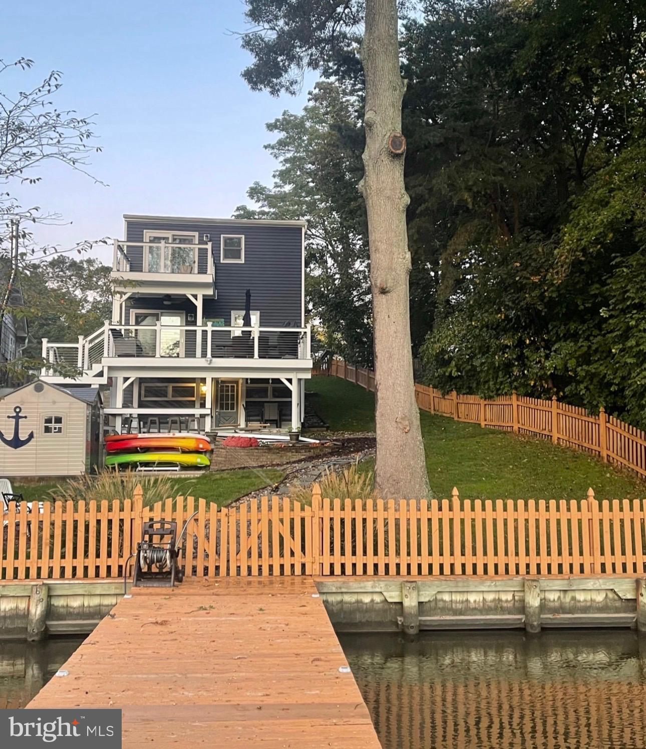 787 Powhatan Beach Road Pasadena, MD 21122 - Photo 5 of 12 a front view of a house with a garden