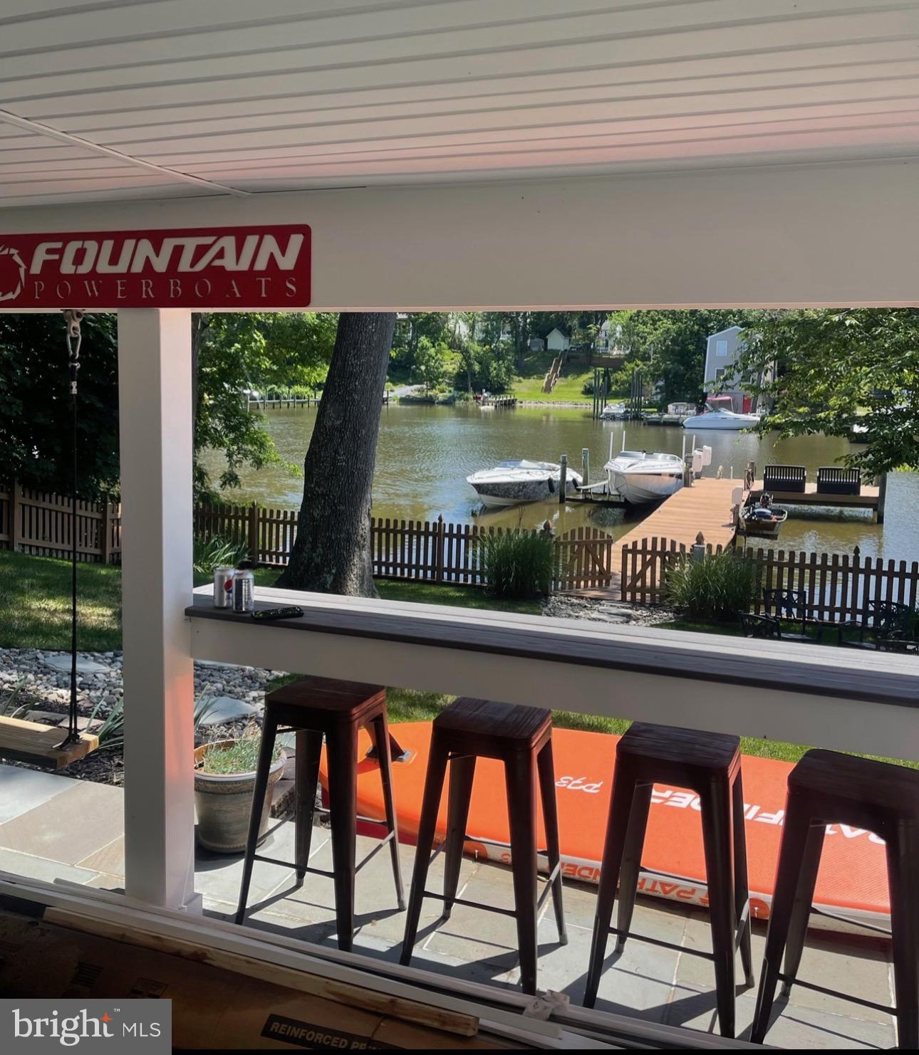 787 Powhatan Beach Road Pasadena, MD 21122 - Photo 9 of 12 a view of swimming pool with a table and chairs in patio