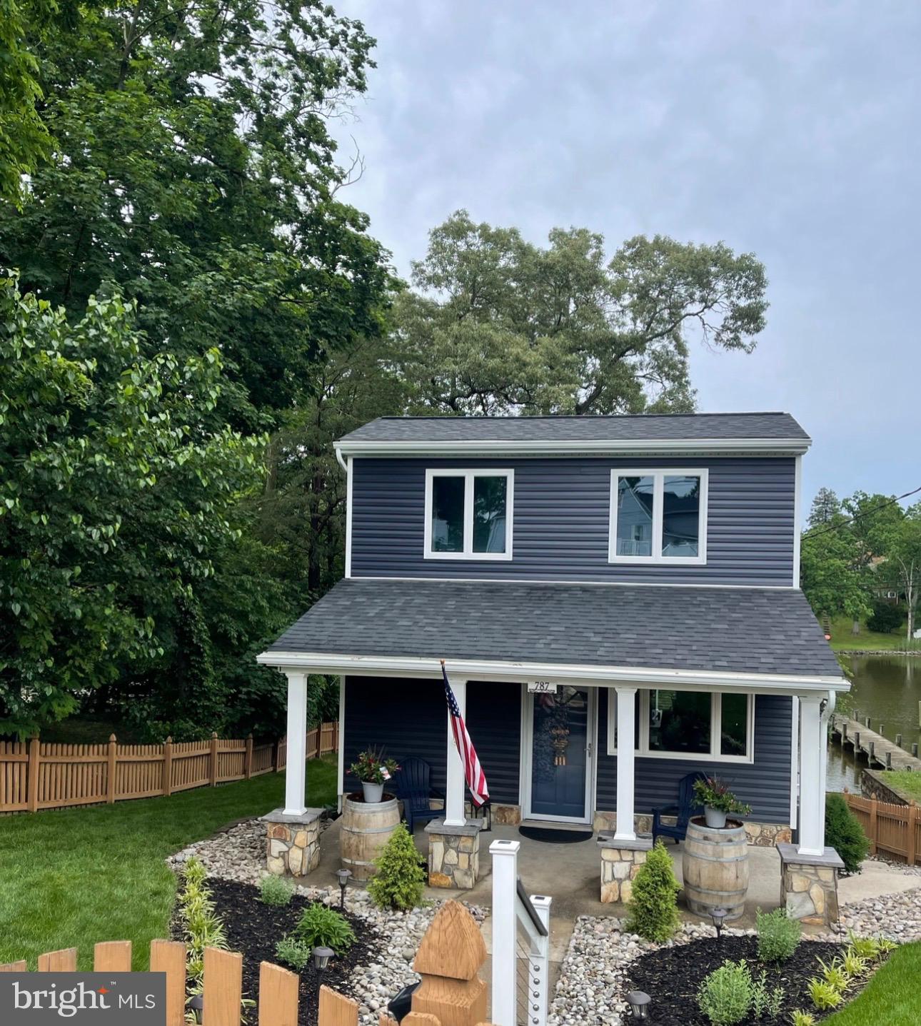 787 Powhatan Beach Road Pasadena, MD 21122 - Photo 10 of 12 a front view of a house with garden