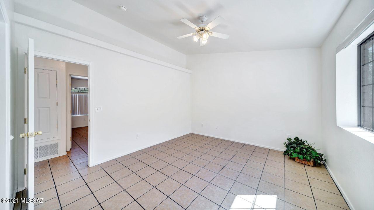 999 Circulo Golondrina Rio Rico, AZ 85648 - Photo 16 of 36 wooden floor in an empty room with a window