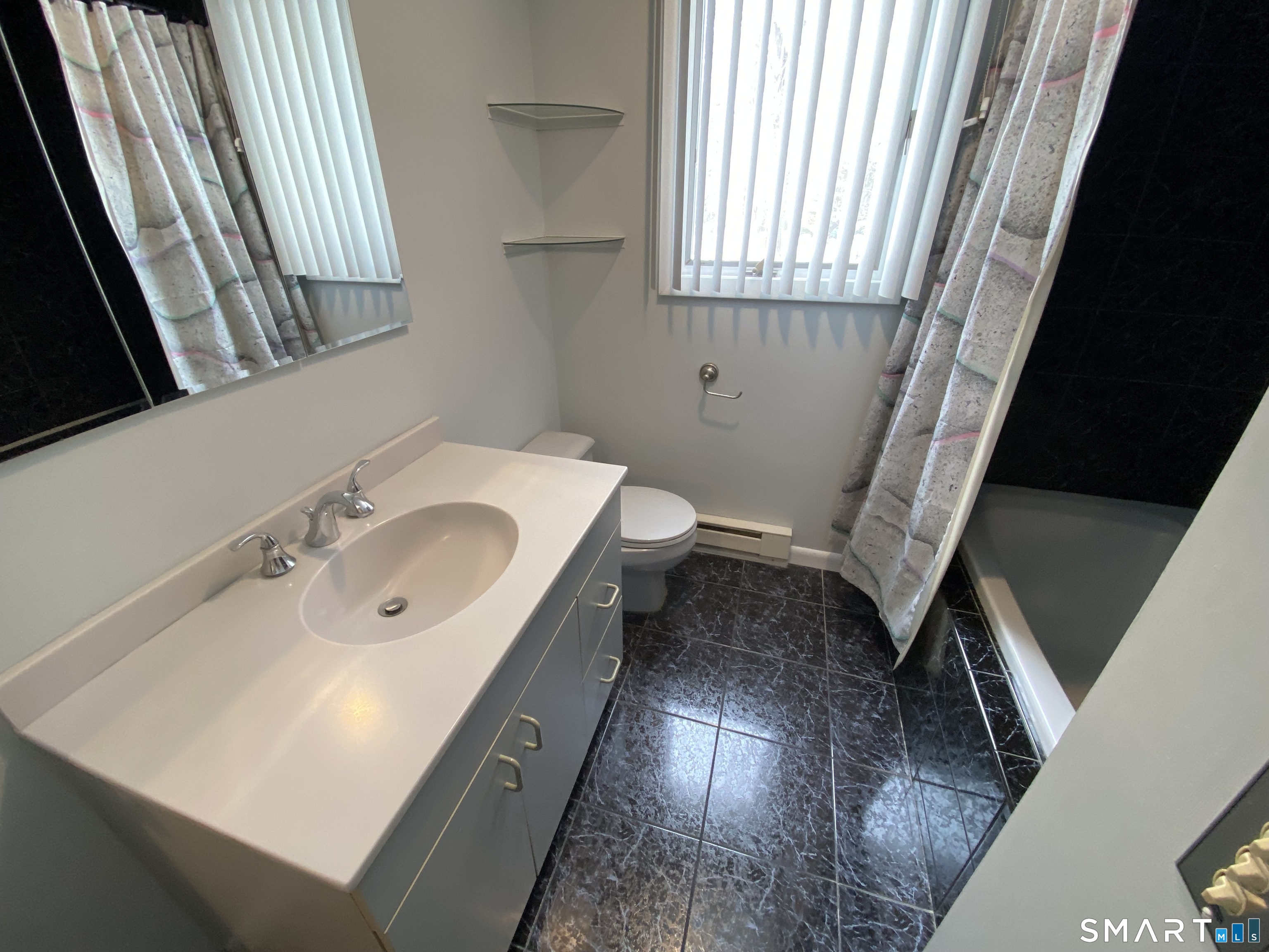 36 Corey Road North Haven, CT 06473 - Photo 12 of 25 a bathroom with a sink and a large window