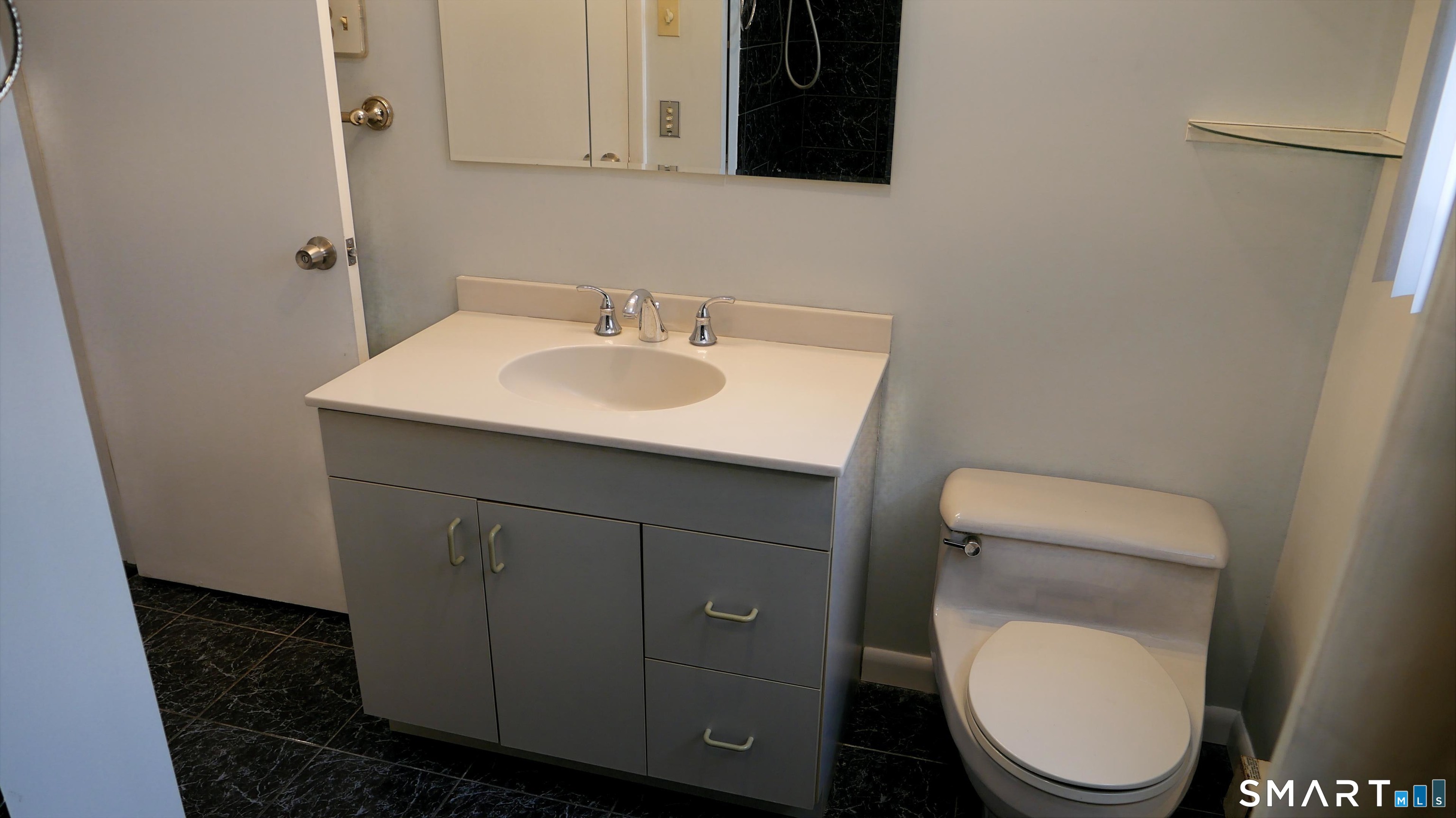 36 Corey Road North Haven, CT 06473 - Photo 13 of 25 a bathroom with a toilet a sink and mirror