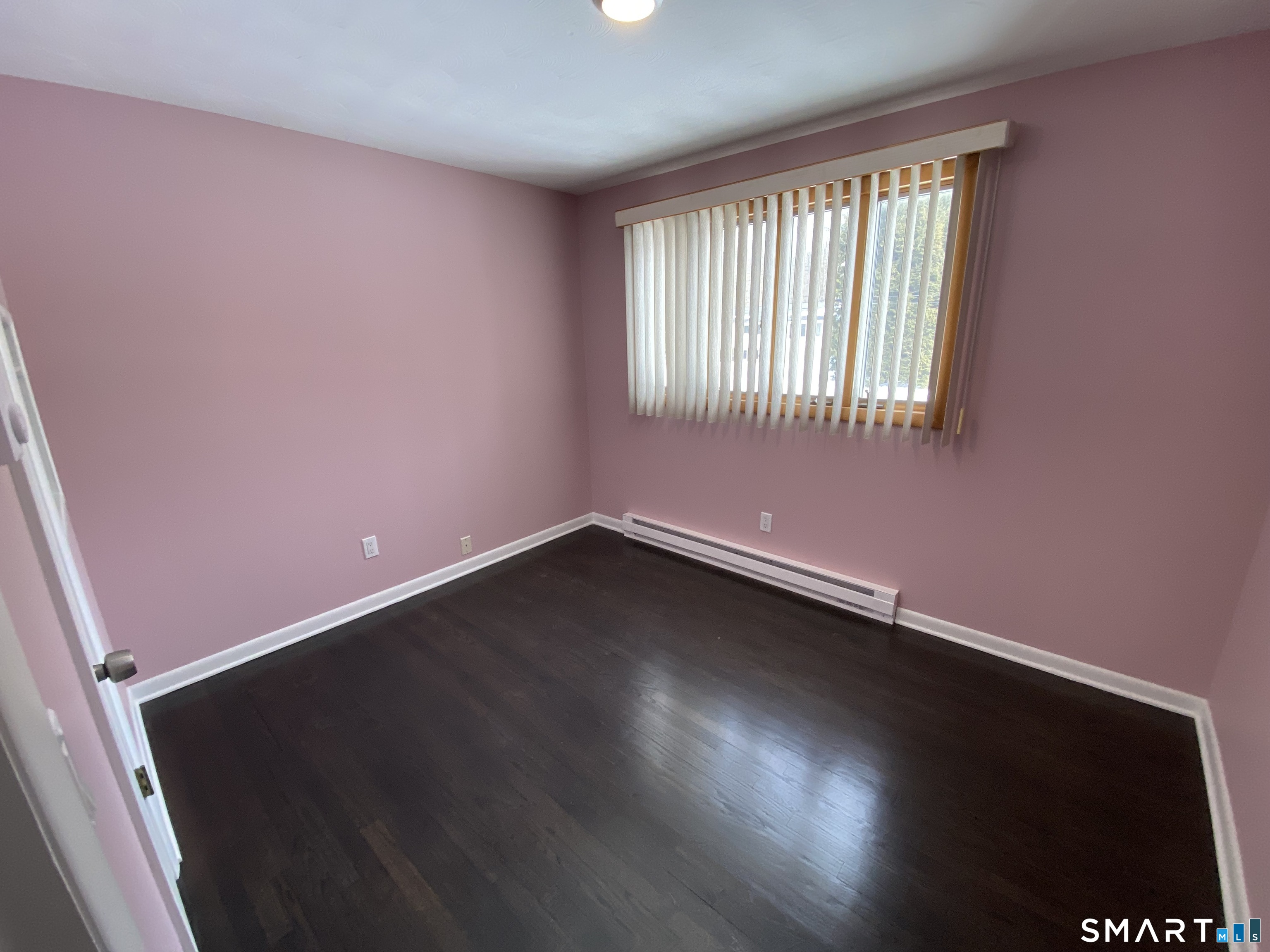 36 Corey Road North Haven, CT 06473 - Photo 16 of 25 an empty room with wooden floor and windows