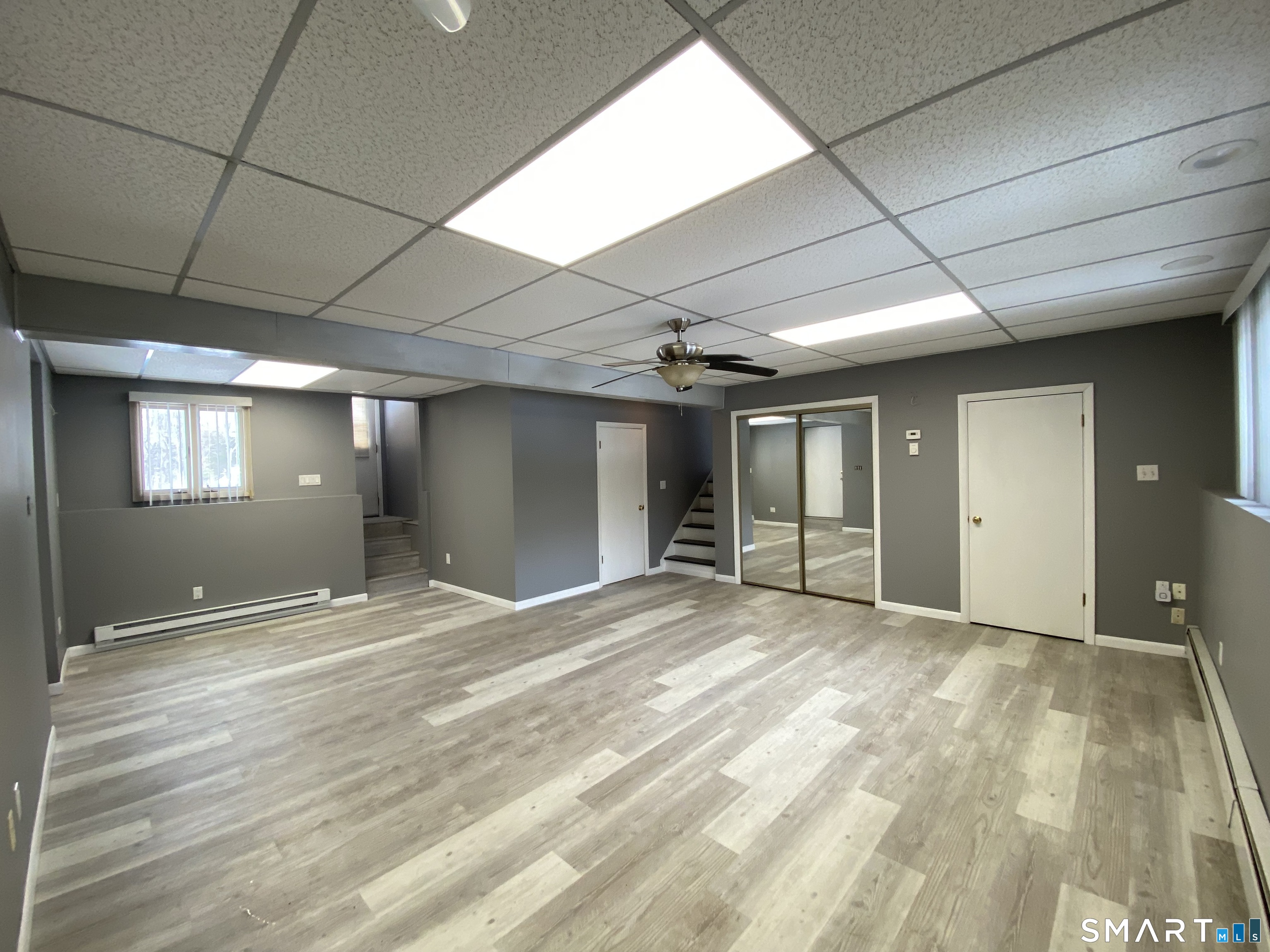 36 Corey Road North Haven, CT 06473 - Photo 19 of 25 a view of an empty room with window and wooden floor