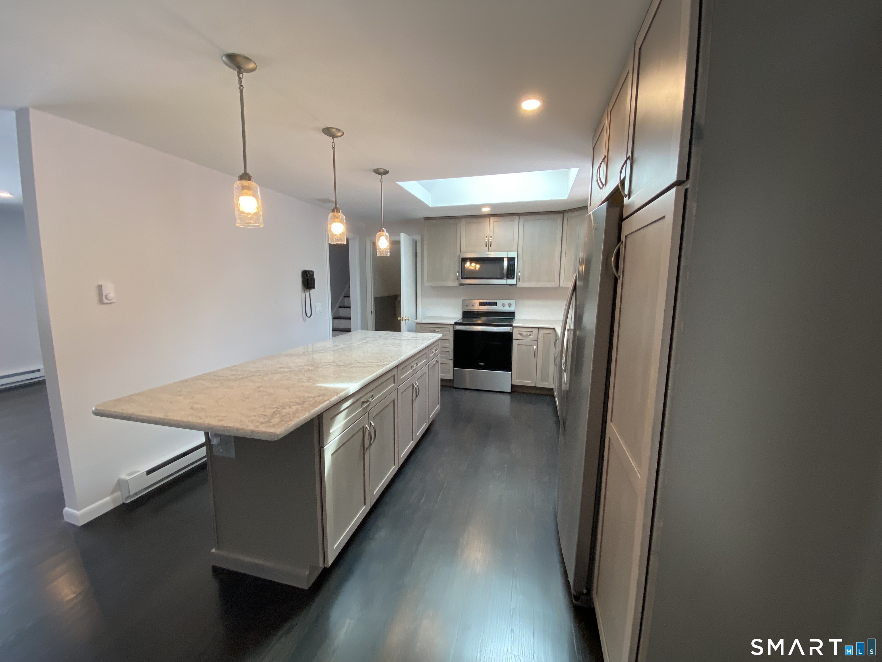 36 Corey Road North Haven, CT 06473 - Photo 7 of 25 a large kitchen with a stove a sink dishwasher a refrigerator and a wooden floor