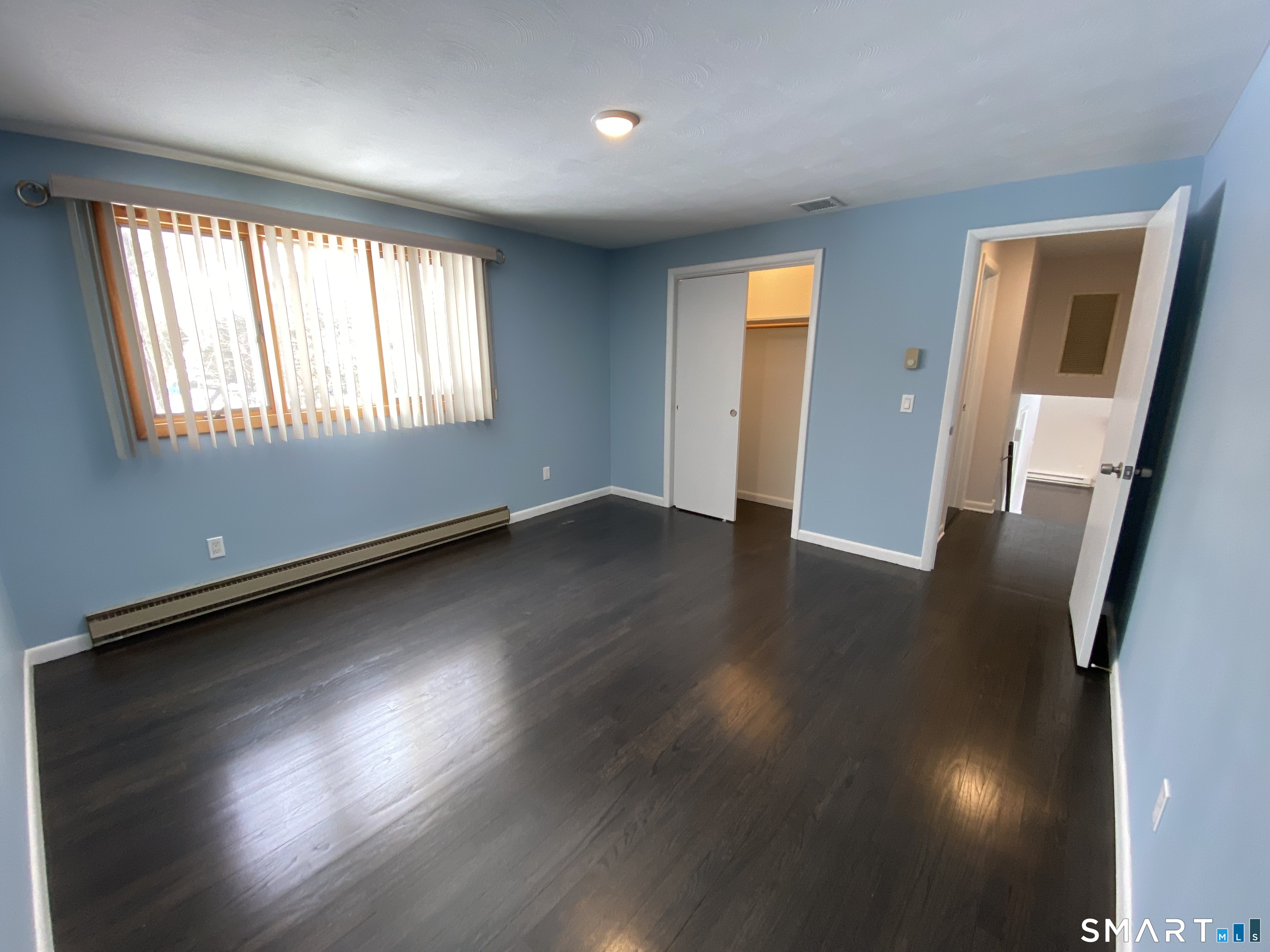 36 Corey Road North Haven, CT 06473 - Photo 10 of 25 an empty room with wooden floor and windows