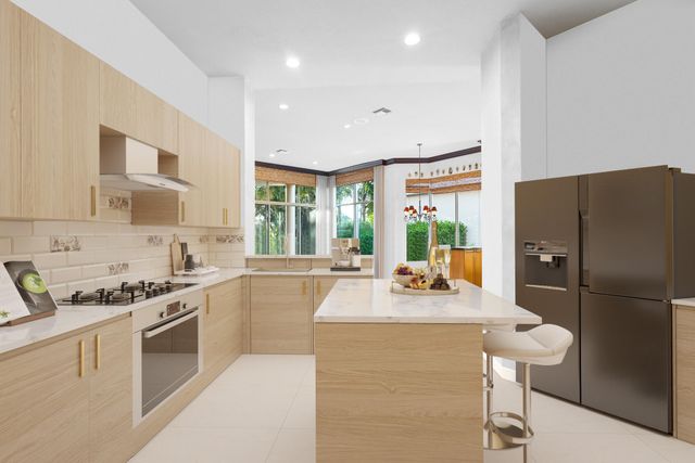 a kitchen with stainless steel appliances granite countertop a refrigerator a sink dishwasher a stove and a dining table with wooden floor