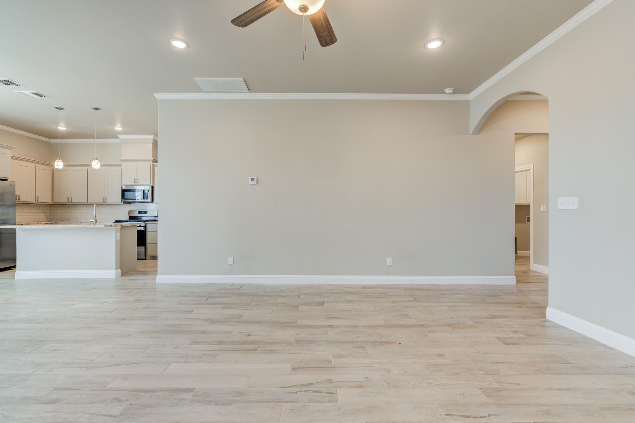 7633 87th Street Lubbock, TX 79424 - Photo 13 of 47 a view of kitchen with furniture and wooden floor