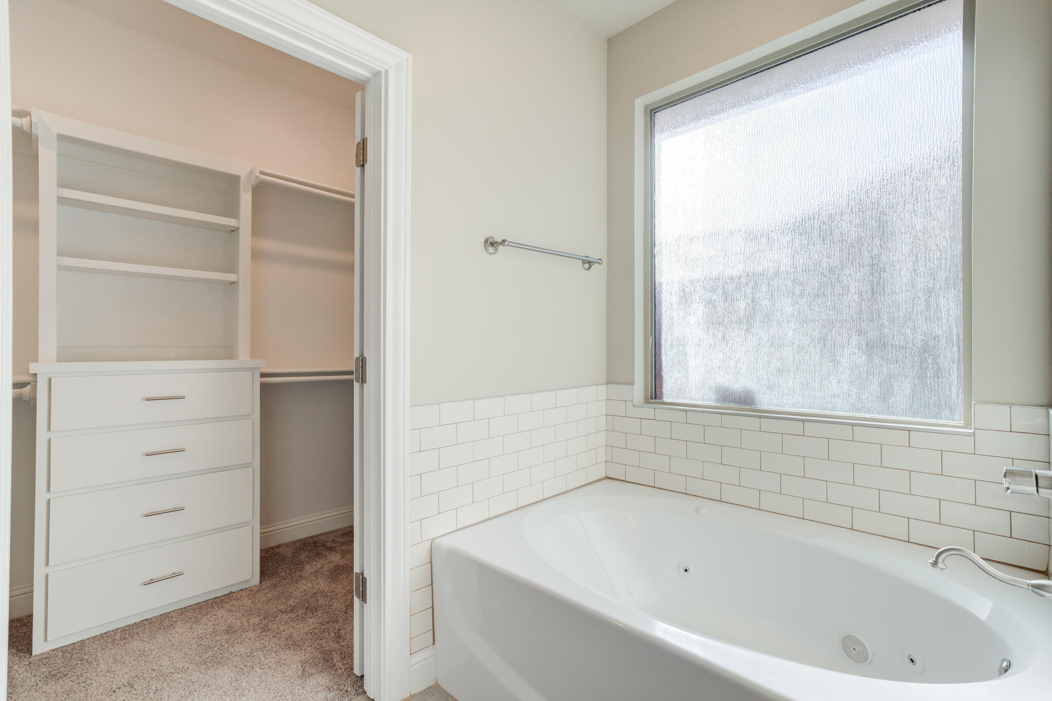 7633 87th Street Lubbock, TX 79424 - Photo 35 of 47 a bathroom with a bathtub and a shower