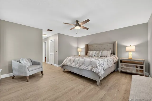 a bedroom with a bed and a couch