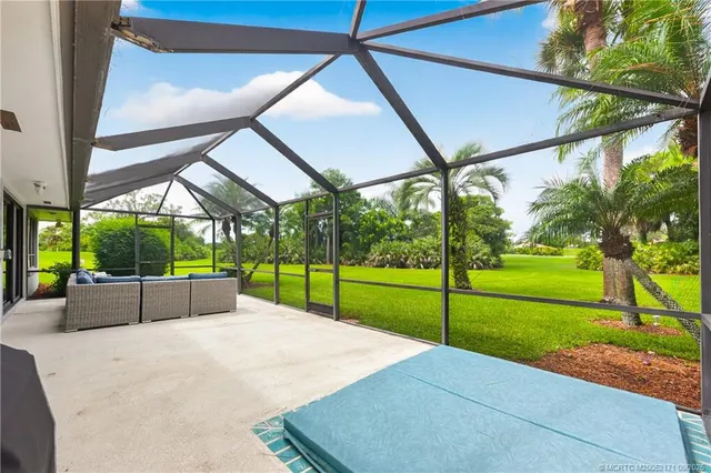 a view of a yard with a patio