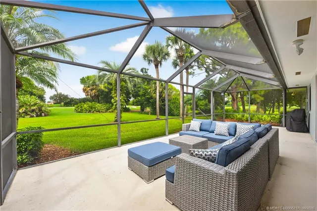 a view of a couches in patio of a yard