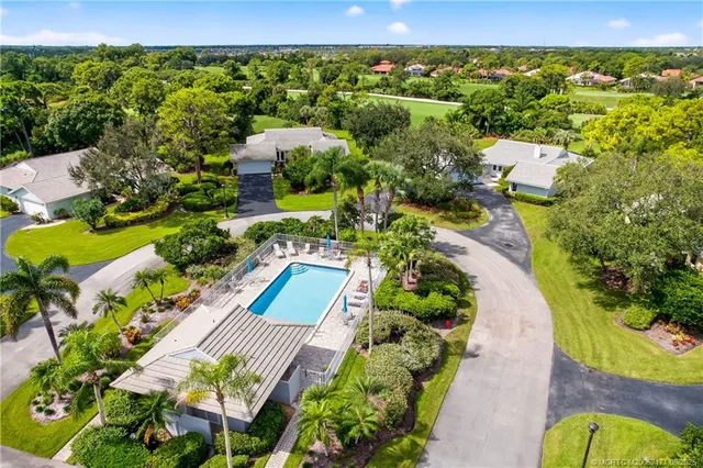 an aerial view of a house with a garden