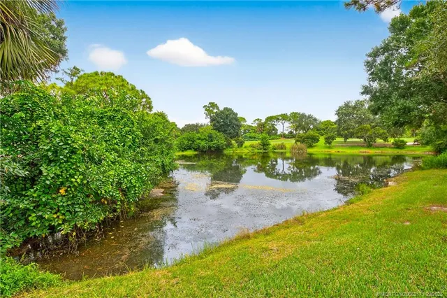 a view of a lake with a big yard