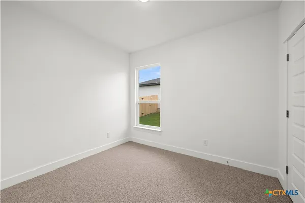 a bathroom with a granite countertop sink a toilet and bathtub