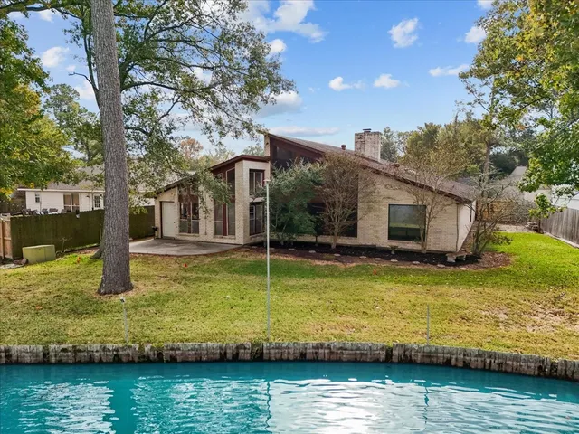 a kitchen with stainless steel appliances granite countertop a refrigerator a sink a stove and island