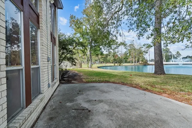 a kitchen with a sink a counter top space and cabinets