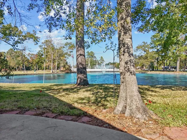 a kitchen with a sink appliances and cabinets