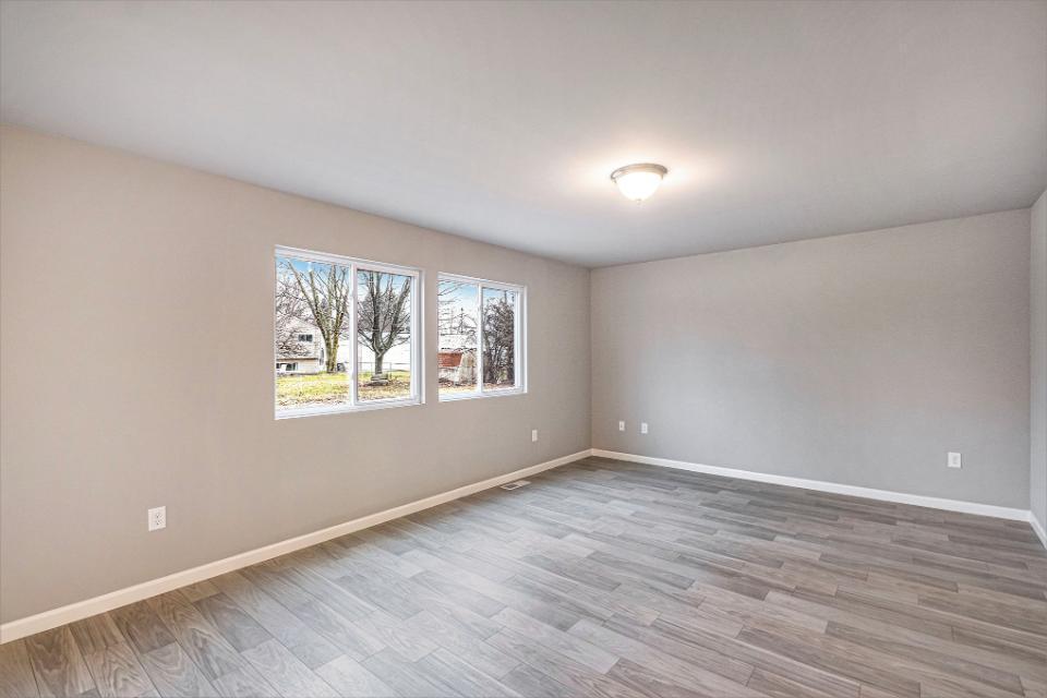 42 Karner Blue Court Chesterton, IN 46304 - Photo 3 of 30 a view of an empty room with wooden floor and a window