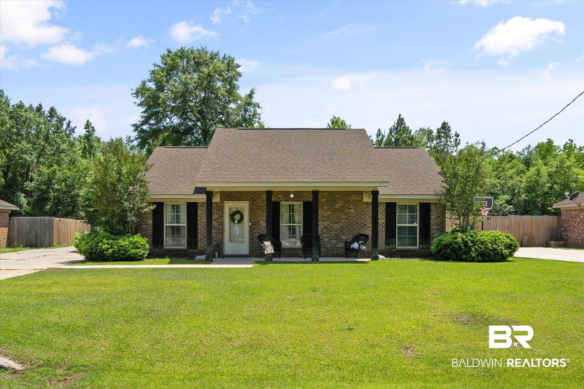 1411 Creola Axis Loop Road North Axis, AL 36505 - Photo 1 of 21 View of front of property featuring a porch, brick siding, and roof with shingles