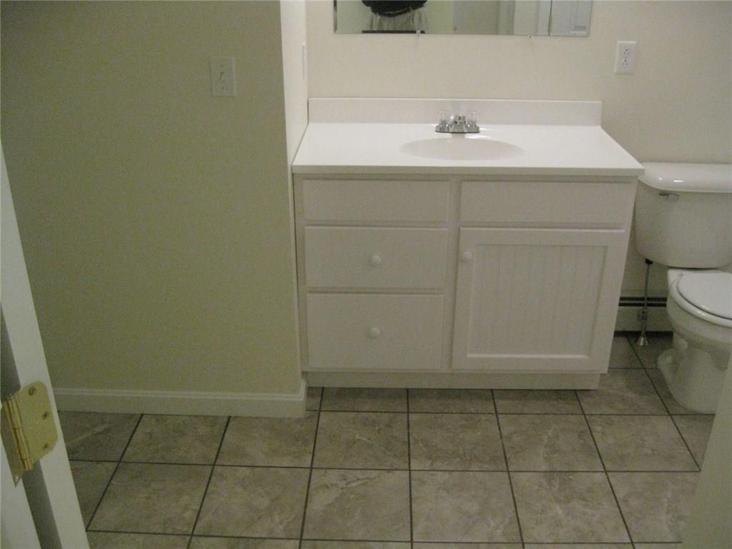 491 Wingood Road Windsor, ME 04363 - Photo 13 of 13 Bathroom with tile floor and laundry...