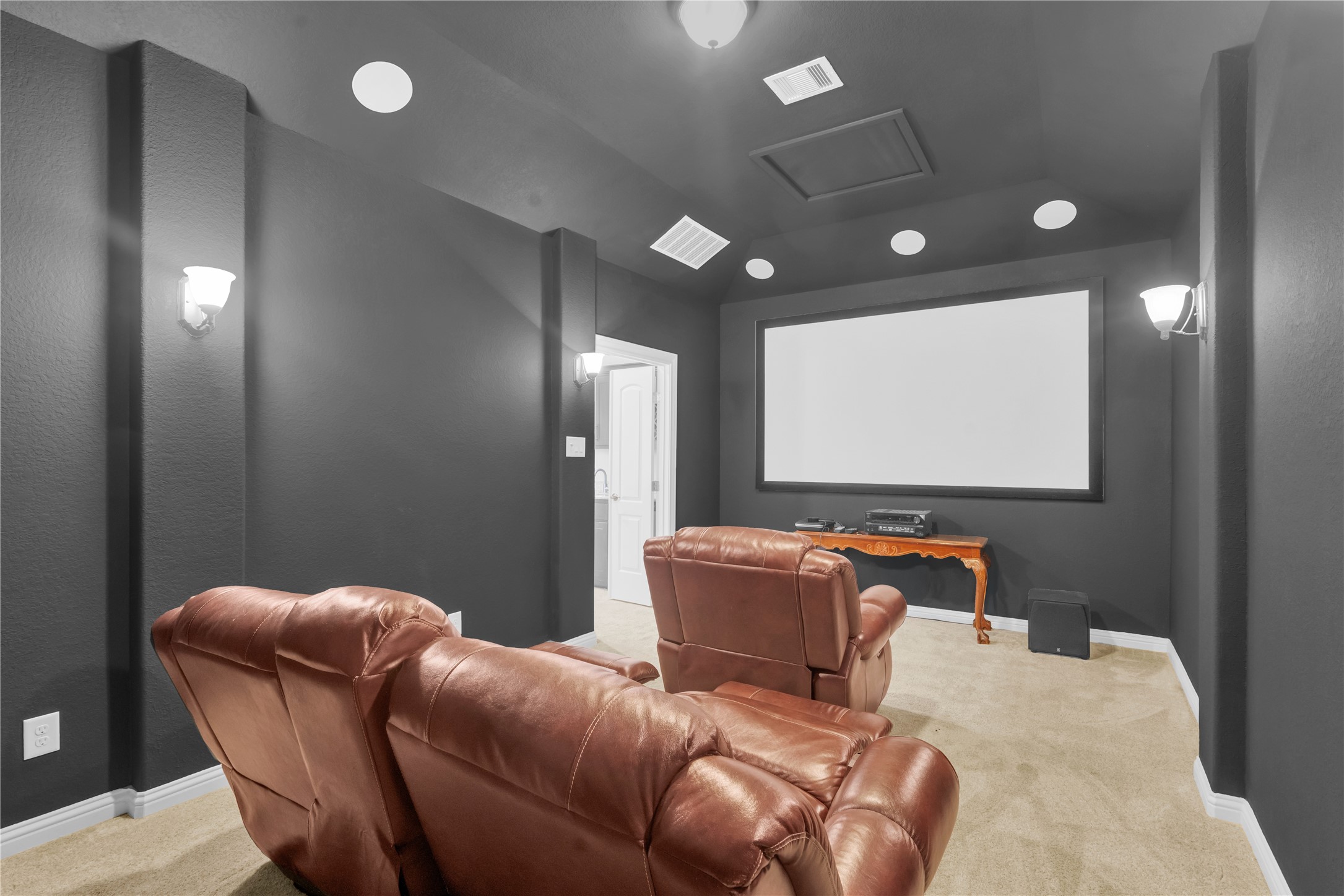 9842 Kirkstone Terrace Drive Spring, TX 77379 - Photo 21 of 34 This home theater room has built in projector and large screen, creating an ideal space for movie nights!