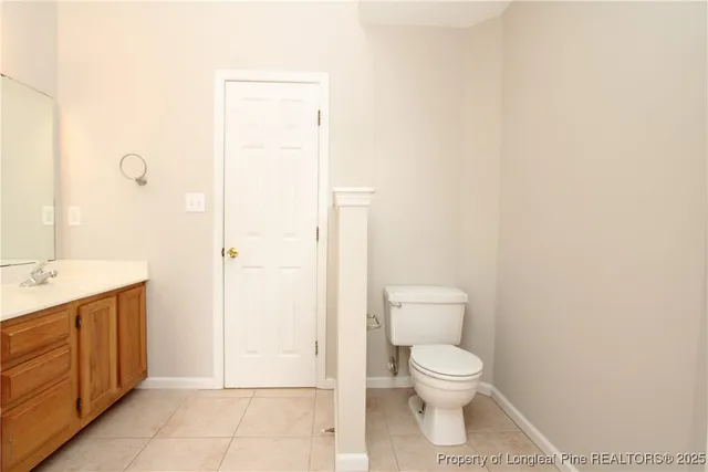 a bathroom with a toilet a sink and shower