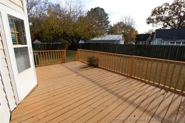 a view of deck with wooden floor and outdoor seating