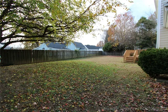 a backyard of a house with lots of green space