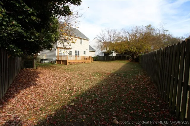 a view of a yard with a house
